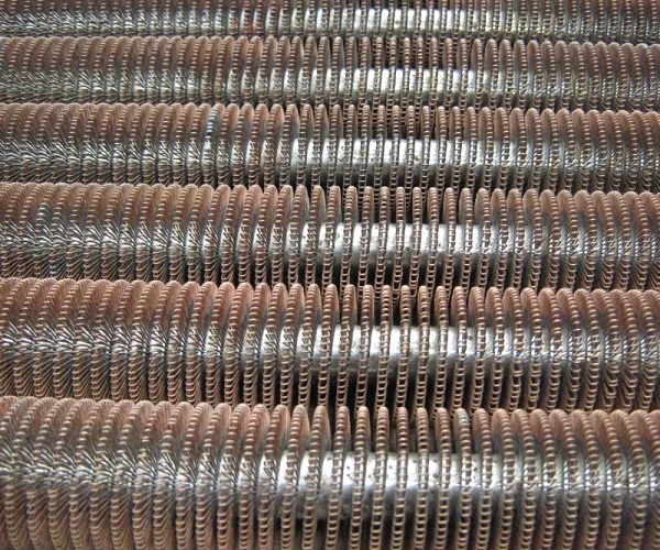 Photo of many Steel tubes with copper wire windings